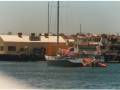 SOYC-062-Stars-Stripes-leads-Destiny-into-Fishing-Boat-Harbour
