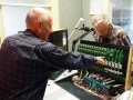 Laurie-McIlree-and-Ray-Alford-Inspect-the-Panel-and-its-Electronics