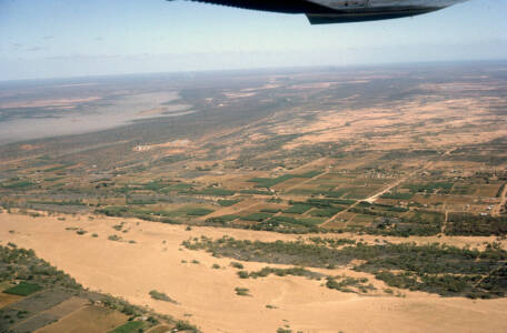 CVN 42 Over Carnarvon Looking Inland, In The Distance OTC(A) Carnarvon Earth Station And The NASA Tracking Station, 28 Dec 1966