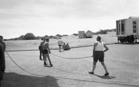 CVN 53 Prep For Cyclone Elsie Staff Secure The Antenna With Steel Hawsers, 19 Jan 1967, Cyclone 'Elsie' 22 Jan 1967, Deputy SM Jack Gray 1st on RH (white singlet)